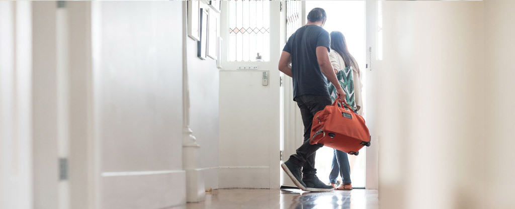 couple leaving home for vacation